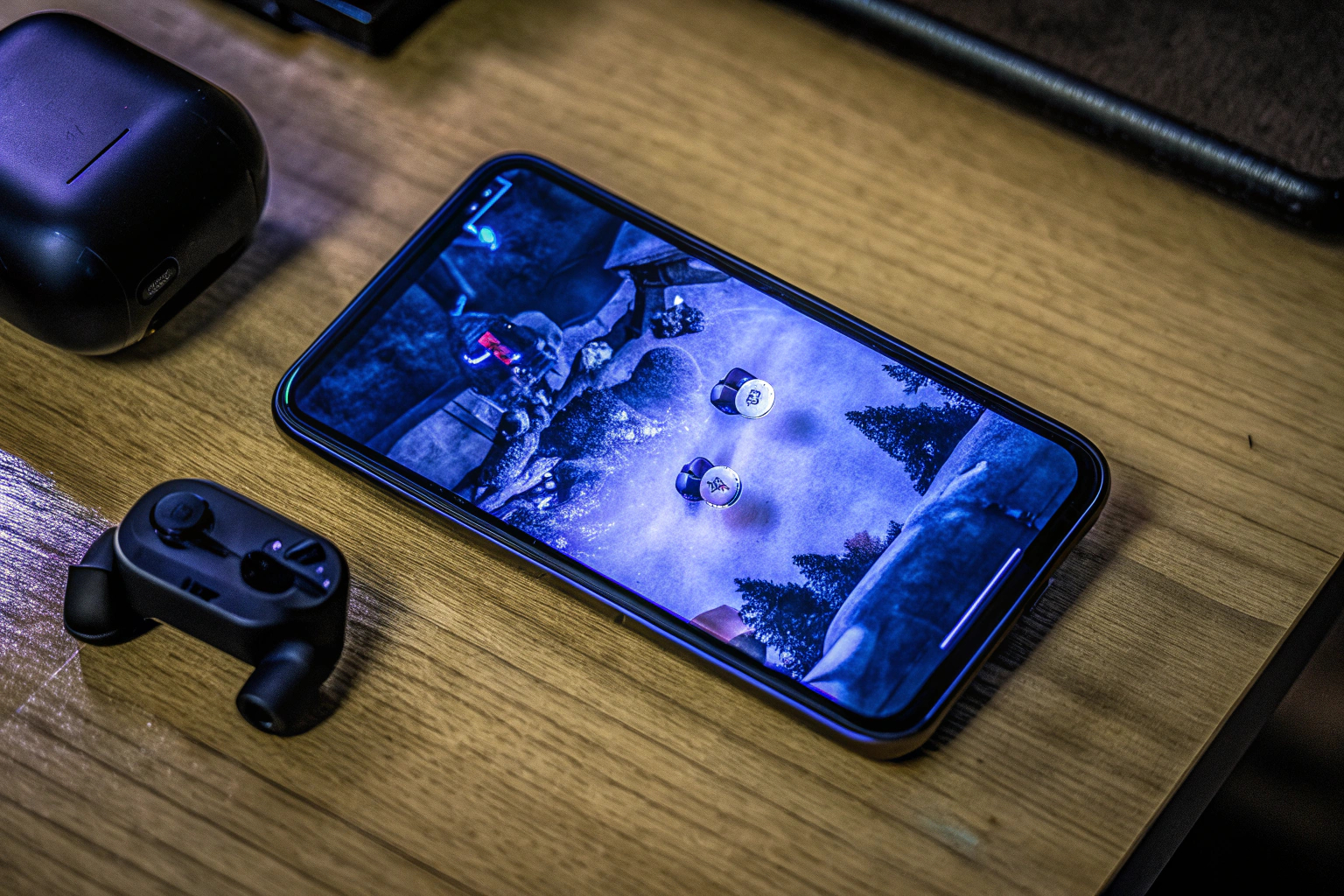 Ein modernes Gaming-Smartphone mit einem farbenfrohen Spiel auf dem Bildschirm Gaming-Smartphone mit Spiel
