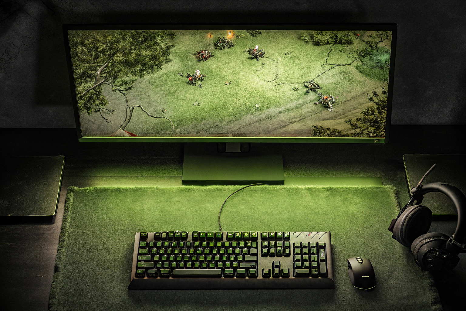 Ein spannendes MOBA-Spiel, das auf einem Bildschirm gespielt wird, umgeben von Gaming-Equipment. MOBA-Spiel mit Gaming-Setup